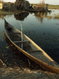Buy Empty Rowboat in the Water across from a Rubeh Island Village at AllPosters.com