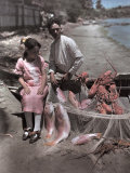 Buy Puerto Rican Girl and Man Sit on the Bow of a Boat with their Catch at AllPosters.com