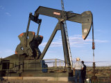 Buy Two Workers Standing Next to an Oil Rig at AllPosters.com