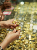 Buy Shoppers Examine Gold Watches in a Shop in Little India, Singapore at AllPosters.com