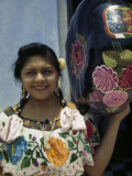 Woman Holds a Jicara, a Painted Gourd, Used as a Bowl