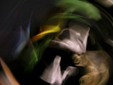 White Origami Peace Crane Swirling About with Other Colorful Pieces