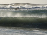 Waves Crash Against Rocks at the Camps Bay Beach, South Africa