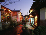Buy Shops and Restaurants Along a Stone Cobbled Street in Lijiang at Night at AllPosters.com
