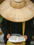 Buddhist Nun Reading on a Bridge in the Tienhsiang Area of Taroko Gorge, Taiwan