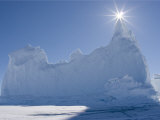 Buy Sun Shines over the Peak of an Iceberg Frozen into the Ice at AllPosters.com