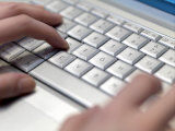 Female Hands Typing on Computer Keyboard