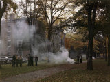 Buy Students Gather by a Leaf Fire Outside a Dormitory at Bowdoin College at AllPosters.com