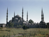 Buy Blue Mosque Sits at Edge of Blooming Flower Garden and Lawn at AllPosters.com