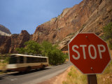 Propane Driven Shuttle Bus Passes a Stop Sign in Zion National Park
