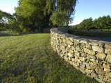 Buy Curved Stone Wall Next to a Closely Cropped Lawn at AllPosters.com