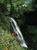 Horseback Riders Stop to Fix a Meal Near a Gentle Waterfall