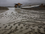 Trucks Hauling Waste Rock at Batu Hijau, a Copper and Gold Mine