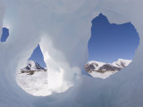 Buy Mountain Peaks on Coburg Island Seen Through Holes in a Piece of Ice at AllPosters.com