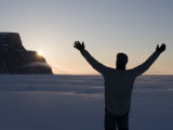 Buy Man Standing on Frozen Ocean Welcoming the Sunrise with Open Arms at AllPosters.com
