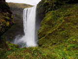 Waterfall and Surrounding Rock Covered in Lush Mosses