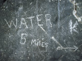 Sign for Water Etched by Pioneers into a Rock in Death Valley