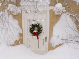 Buy Snow Covered Christmas Wreath with a Bow Adorns a Door in Santa Fe at AllPosters.com