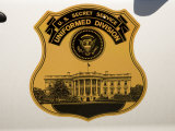 Buy Insignia of the U.S. Secret Service on Car Door Shows the White House at AllPosters.com