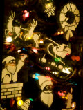 Window with Holiday Stencils Reflects Christmas Tree Lights