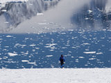 Buy Man at a Calm Bay with Pieces of Pack Ice and Mountain Reflions at AllPosters.com
