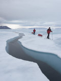 Buy Two Skiers Pull their Sleds on the Sea Ice Next to an Open Lead at AllPosters.com