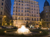 Buildings and a Fountain at Dusk Along the Gran Via in Madrid