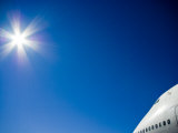 Nose Cone of a 747 Passenger Aircraft Soars into a Clear Blue Sky