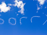 Plane Sign Writer Paints Sorry into a Clear Blue Sky with Smoke