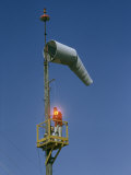 Buy Man Uses Lightgun to Signal Aircraft Approaching Regional Airport at AllPosters.com