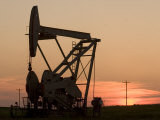 Oil Drilling Pump Silhouetted Against the Sunset in North Dakota