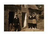 Buy Girls Stand Outside Thatched Cottages in Brittany at AllPosters.com