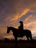 Buy Silhouetted Cowboy Actor on Horseback on an Old Western Movie Set at AllPosters.com