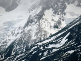 Sheer Crags of the Andes Massif Covered in Snow and Ice