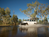 Car Driving Through River Crossing Near Alice Springs, Australia