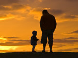 Buy Father and His Baby Son Watch the Sunrise from a Coastal Hilltop at AllPosters.com