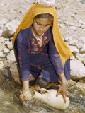 Buy Woman Collects Water in an Old-Fashioned Pottery Jug at AllPosters.com