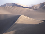 Buy High Sand Dunes Surround the Small Oasis Village of Huacachina, Peru at AllPosters.com