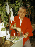 Buy Biologist in a Greenhouse Collects Seeds from a Potato Fruit at AllPosters.com