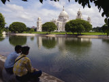 Buy Two Young Men Look across Water at Lord Curzon?S Victoria Memorial at AllPosters.com