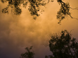 Dust from Drought-Stricken Farmland Mixes with Storm Clouds at Sunset