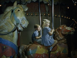 Buy Girl and Boy Ride Carousel Horses at AllPosters.com