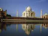 Buy At Sunrise the Taj Mahal's Reflection Shimmers in Tranquil River at AllPosters.com