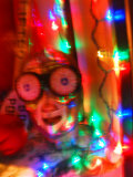 Mask and Christmas Lights in a Costume Shop Window in San Francisco