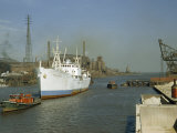 Buy Ship Entering Calumet River Passes Docks Loaded with Coal and Grain at AllPosters.com