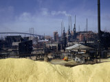 Buy Large Pile of Sulfur Dominates a View of a Chemical Plant at AllPosters.com
