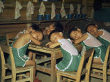Buy Seated Refugee Boys Rest their Heads on their Arms for a Nap at AllPosters.com