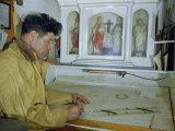 Buy Fishing Boat Captain Keeps an Altar Above His Nautical Charts Table at AllPosters.com