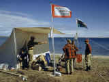 Buy Scientists Stand Outside a Cook Tent Pitched Beside an Arctic Lake at AllPosters.com