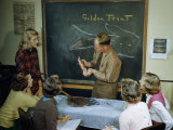 Buy Man Holds Up Live Golden Trout for Students to Identify at AllPosters.com